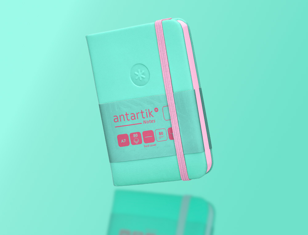 CARNET A7 ANTARTIK NOTES PAPIER UNI IVOIRE COUVERTURE RIGIDE FERMETURE ELASTIQUE ROSE 160 PAGES 80GR COLORIS TURQUOISE