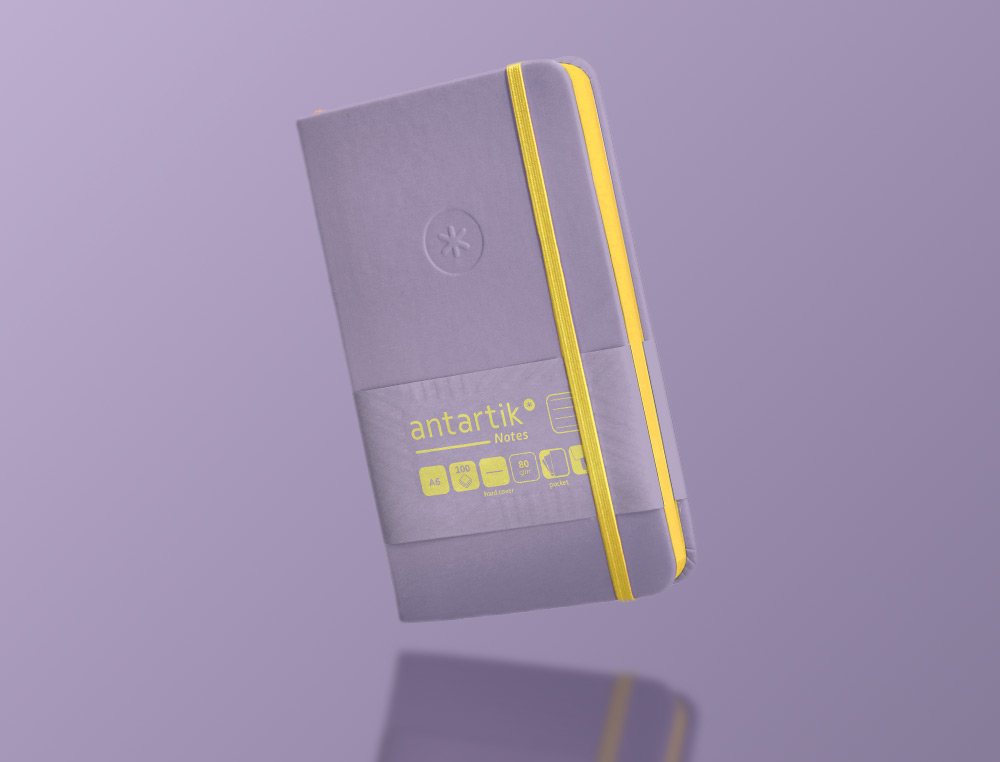 CARNET A6 ANTARTIK NOTES LIGNECOUVERTURE RIGIDE FERMETURE ELASTIQUE JAUNE 100 PAGES 80GRCOLORIS LILAS