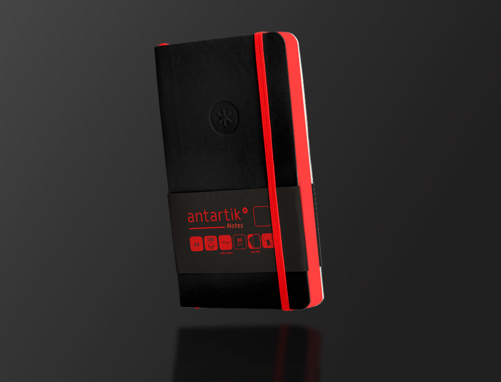 CARNET A6 ANTARTIK NOTES PAPIER UNI IVOIRE COUVERTURE SOUPLE FERMETURE ELASTIQUE ROUGE 100 PAGES 80GR COLORIS NOIR